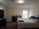 Main bedroom with carpet, neutral colors, and a dresser at 5852 Clear Haven Ln, North Las Vegas, NV 89081