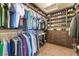 Well-organized walk-in closet with ample storage and custom shelving for shoes and clothing at 5852 Clear Haven Ln, North Las Vegas, NV 89081