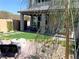 Serene backyard featuring artificial turf, decorative stone, and a cozy seating area at 6511 Dove Point Pl, Las Vegas, NV 89130