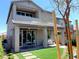 Beautiful home exterior with a well-manicured backyard, patio, and lush landscaping at 6511 Dove Point Pl, Las Vegas, NV 89130