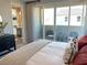 Comfortable bedroom featuring a cozy bed, balcony access, and stylish decor for a relaxing atmosphere at 6511 Dove Point Pl, Las Vegas, NV 89130