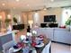 Open-concept dining room with modern decor, seamlessly connecting the living and kitchen spaces for easy entertaining at 6511 Dove Point Pl, Las Vegas, NV 89130