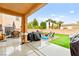 Entertain in this home's backyard featuring an outdoor kitchen and patio area at 6624 Jade Jaguar St, North Las Vegas, NV 89086