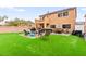 Enjoy the spacious backyard with lush artificial grass, perfect for outdoor activities at 6624 Jade Jaguar St, North Las Vegas, NV 89086