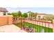 Cozy balcony with chairs overlooking a barbecue area and green space at 6624 Jade Jaguar St, North Las Vegas, NV 89086