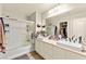Bathroom featuring double sinks, quartz countertops, a bathtub, and a shower at 6624 Jade Jaguar St, North Las Vegas, NV 89086