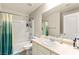 Well-lit bathroom featuring a tub, shower, vanity, and tile flooring at 6624 Jade Jaguar St, North Las Vegas, NV 89086