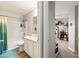 Well-lit bathroom featuring a tub, shower, vanity, and tile flooring at 6624 Jade Jaguar St, North Las Vegas, NV 89086