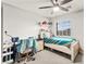 Bright bedroom featuring a ceiling fan, window, desk, and chair, providing plenty of storage at 6624 Jade Jaguar St, North Las Vegas, NV 89086