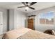 Comfortable bedroom features a ceiling fan, closet, and window offering plenty of natural light at 6624 Jade Jaguar St, North Las Vegas, NV 89086
