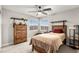 Bedroom with carpet, a ceiling fan and a closet at 6624 Jade Jaguar St, North Las Vegas, NV 89086