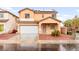 Charming two-story home with well-maintained lawn, two-car garage, and welcoming front porch at 6624 Jade Jaguar St, North Las Vegas, NV 89086