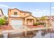 Charming two-story home with well-maintained lawn, two-car garage, and welcoming front porch at 6624 Jade Jaguar St, North Las Vegas, NV 89086