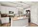 Modern kitchen featuring stainless steel appliances, a kitchen island and modern lighting at 6624 Jade Jaguar St, North Las Vegas, NV 89086