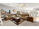Comfortable living room with a large sectional sofa and bright natural light at 6624 Jade Jaguar St, North Las Vegas, NV 89086