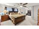 Spacious main bedroom featuring a ceiling fan, ensuite bathroom, and walk-in closet at 6624 Jade Jaguar St, North Las Vegas, NV 89086