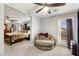 Comfortable main bedroom featuring a ceiling fan, reading nook and access to balcony at 6624 Jade Jaguar St, North Las Vegas, NV 89086