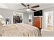 Comfortable main bedroom featuring a ceiling fan, ensuite bathroom, and walk-in closet at 6624 Jade Jaguar St, North Las Vegas, NV 89086