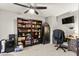 Office space with a desk, bookshelves and carpet at 6624 Jade Jaguar St, North Las Vegas, NV 89086
