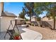 Spacious backyard featuring a charming pergola-covered patio area and desert-friendly landscaping, perfect for outdoor living at 688 Castlebridge Ave, Las Vegas, NV 89123