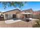 Enjoy this private backyard complete with patio, gravel area, and a covered seating area perfect for outdoor gatherings at 688 Castlebridge Ave, Las Vegas, NV 89123