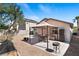Relax in this backyard with a large patio area featuring a shaded pergola and low-maintenance landscaping at 688 Castlebridge Ave, Las Vegas, NV 89123