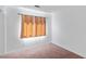 Neutral bedroom features a window with curtains allowing natural light to fill the room at 688 Castlebridge Ave, Las Vegas, NV 89123