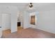 Light bedroom with ceiling fan, window, and access to bathroom and closet at 688 Castlebridge Ave, Las Vegas, NV 89123