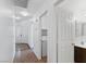 Clean hallway features recessed lighting, a laundry closet, and access to the bathroom and front door at 688 Castlebridge Ave, Las Vegas, NV 89123