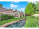 Landscaped backyard features a water feature and well maintained lawn and plantings at 6940 Emerald Springs Ln, Las Vegas, NV 89113