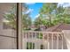 Balcony view overlooking a quiet neighborhood with mature trees at 6940 Emerald Springs Ln, Las Vegas, NV 89113
