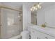 Modern bathroom featuring gold hardware and a glass-enclosed shower at 6940 Emerald Springs Ln, Las Vegas, NV 89113