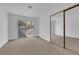 Bedroom with a sliding glass door to balcony and mirrored closet at 6940 Emerald Springs Ln, Las Vegas, NV 89113