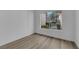 Clean bedroom space with a large window offering natural light at 6940 Emerald Springs Ln, Las Vegas, NV 89113