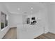 Bright kitchen boasts a stone island, new appliances, and custom cabinets at 6940 Emerald Springs Ln, Las Vegas, NV 89113