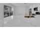 Island of kitchen boasts stainless steel appliances and sink with stone countertops at 6940 Emerald Springs Ln, Las Vegas, NV 89113