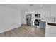 Bright kitchen features stainless steel appliances, white cabinets, and elegant countertops at 6940 Emerald Springs Ln, Las Vegas, NV 89113