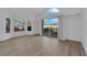 Bright, open living room with large windows and slider offering natural light and views at 6940 Emerald Springs Ln, Las Vegas, NV 89113