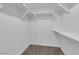 Walk-in closet with white shelving providing ample storage space at 6940 Emerald Springs Ln, Las Vegas, NV 89113