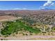 Wide aerial view of the park within the community, featuring mature trees, green spaces, and neighborhood layout at 7715 Peaceful Trellis Dr, Las Vegas, NV 89179
