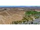 Overhead view of community showcasing desert terrain and a well-maintained community park with walking trails at 7715 Peaceful Trellis Dr, Las Vegas, NV 89179