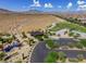 Elevated view of park offering a playground, sports courts, and desert views at 7715 Peaceful Trellis Dr, Las Vegas, NV 89179