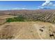 Scenic aerial perspective of community featuring a park, distant mountains, and numerous homes at 7715 Peaceful Trellis Dr, Las Vegas, NV 89179