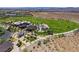 Stunning aerial view of the community park with covered picnic areas, playground, and lush green spaces at 7715 Peaceful Trellis Dr, Las Vegas, NV 89179