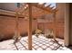 Charming outdoor patio area with a wooden pergola creating a shaded retreat at 7715 Peaceful Trellis Dr, Las Vegas, NV 89179