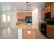 Stylish kitchen with wood-style floors, updated appliances, and oversized island at 7715 Peaceful Trellis Dr, Las Vegas, NV 89179
