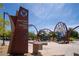 Mountain's Edge Regional Park entrance sign with decorative art installation and landscaping at 7715 Peaceful Trellis Dr, Las Vegas, NV 89179