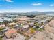 Aerial view of homes featuring backyard pools and lush desert landscaping at 7756 River Mist Ct, Las Vegas, NV 89113