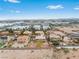 Home surrounded by desert landscape, industrial complex, and mountains in the distance at 7756 River Mist Ct, Las Vegas, NV 89113