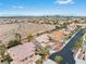Expansive aerial view of a residential neighborhood with desert landscape and city skyline at 7756 River Mist Ct, Las Vegas, NV 89113